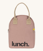 Fluf zip lunch bag in a pastel pink colour with a light brown handle and light brown zip detail on a cream background.