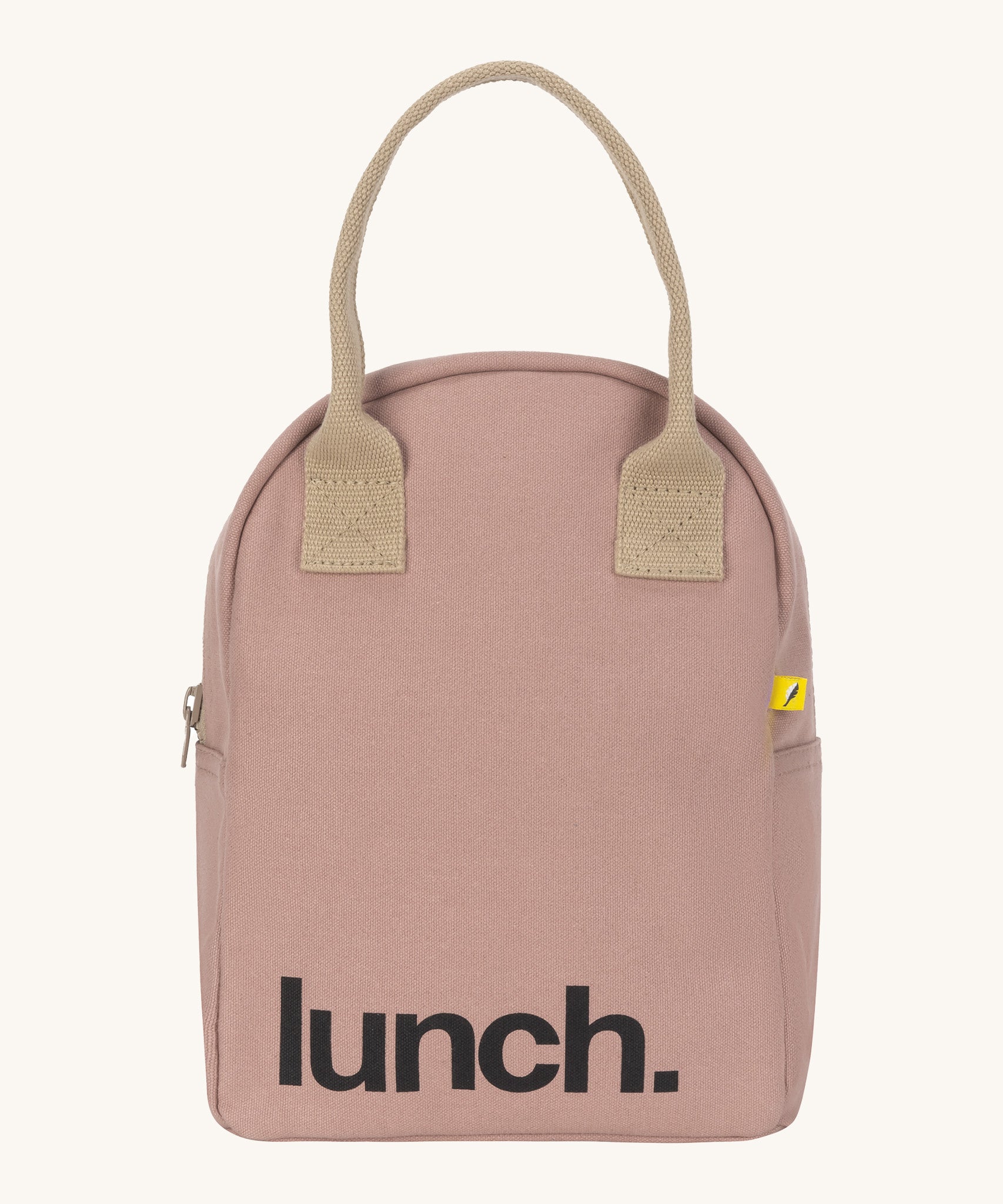 Fluf zip lunch bag in a pastel pink colour with a light brown handle and light brown zip detail on a cream background.