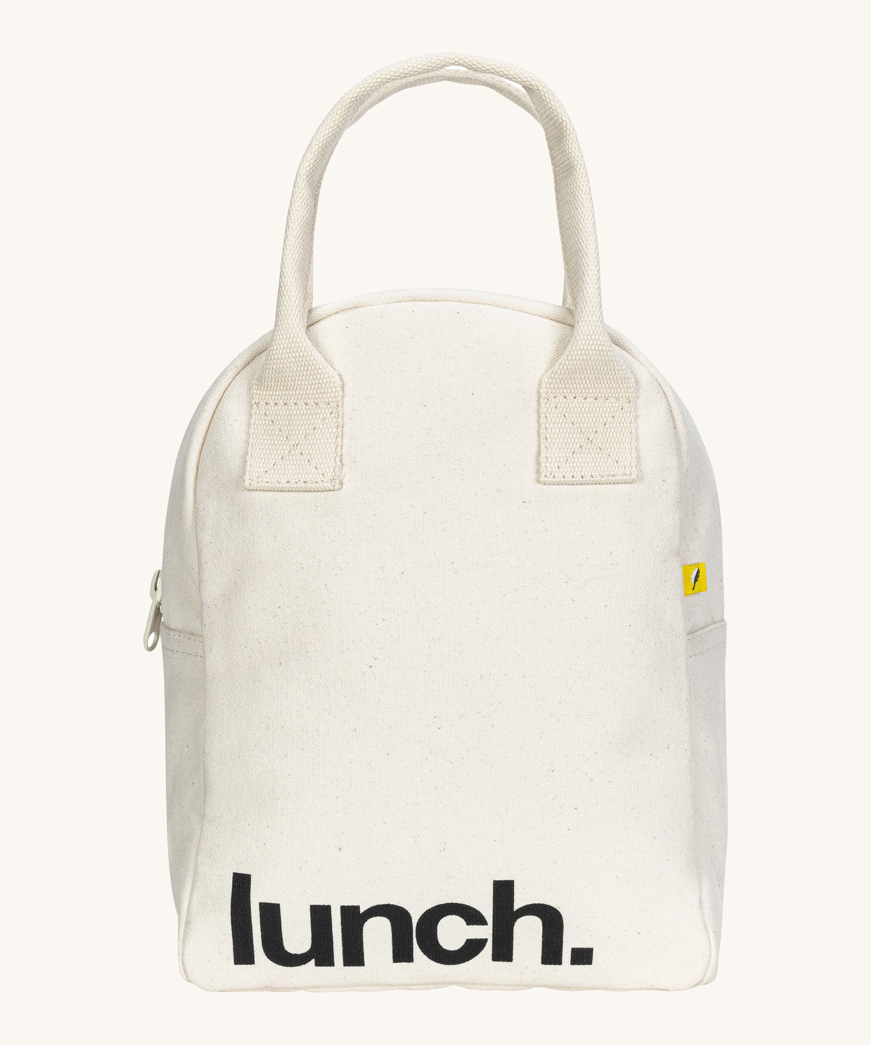 Fluf zip lunch bag in  white with lunch printed on the front in black with a white handle and zip detail on a cream background.