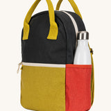 A side view of The organic cotton Fluf B-Pack Jr in carbon cactus, a kids school backpack with a red drink holder side pocket