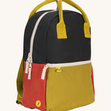 A side view of The organic cotton Fluf B-Pack Jr, a kids school backpack in a black, mustard and red