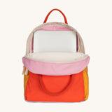 The organic cotton kids Fluf B-Pack Jr, the backpack is unzipped and there's a small laptop inside.