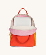 The organic cotton kids Fluf B-Pack Jr, the backpack is unzipped and there's a small laptop inside.