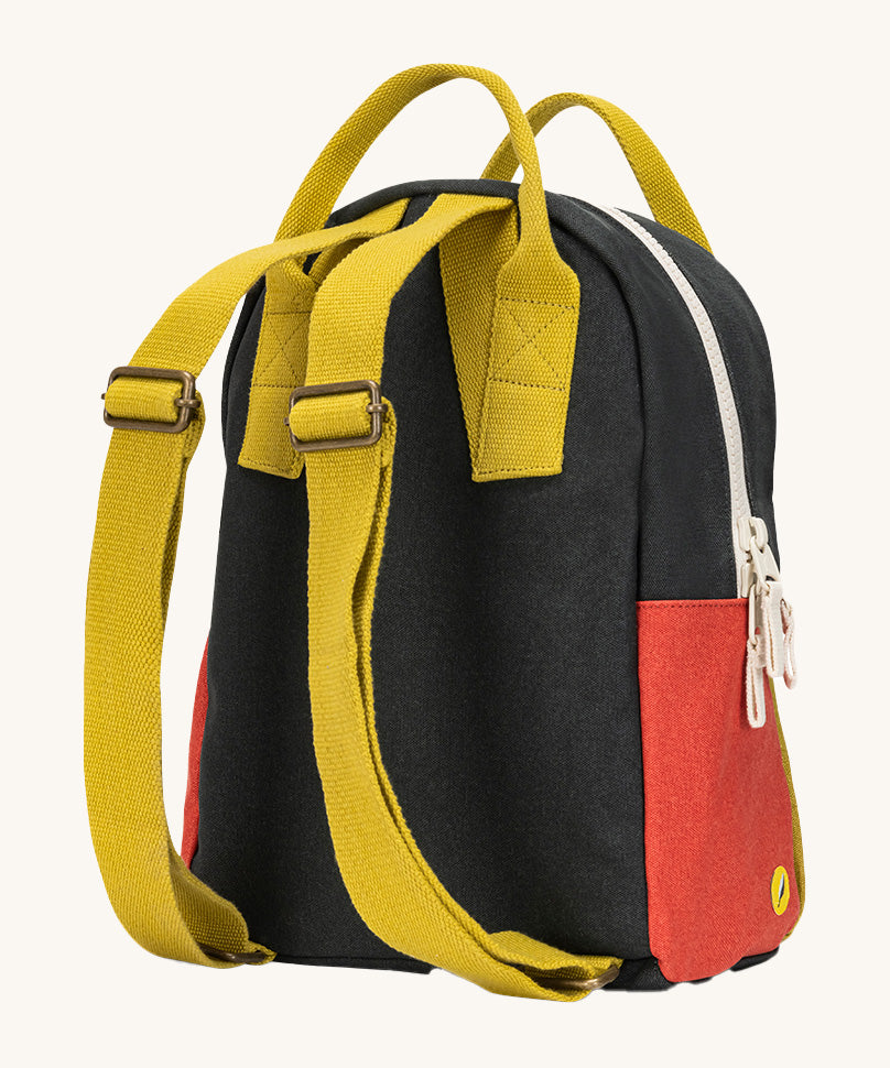 The back of The organic cotton Fluf B-Pack Jr. a kids school backpack with mustard coloured adjustable straps