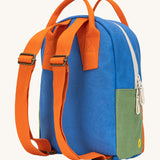 The back of The organic cotton Fluf B-Pack Jr in cobalt orange. a kids school backpack with orange coloured adjustable straps