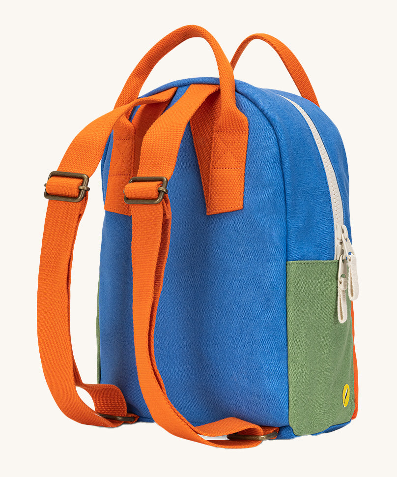 The back of The organic cotton Fluf B-Pack Jr in cobalt orange. a kids school backpack with orange coloured adjustable straps