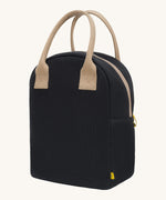 Fluf zip lunch bag in a solid black colour with a light brown handle and light brown zip detail on a cream background.
