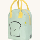 Side view of the Fluf zip lunch bag in light green with a light yellow handle and zip detail. Lunch bag has a playful black outline design of a slice of bread with a smiling face and brand logo in black on the side panel