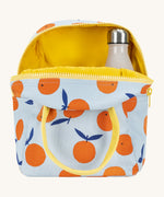 Fluf zip orange lunch bag in a light blue colour showing the yellow inner lining holding a bottle.