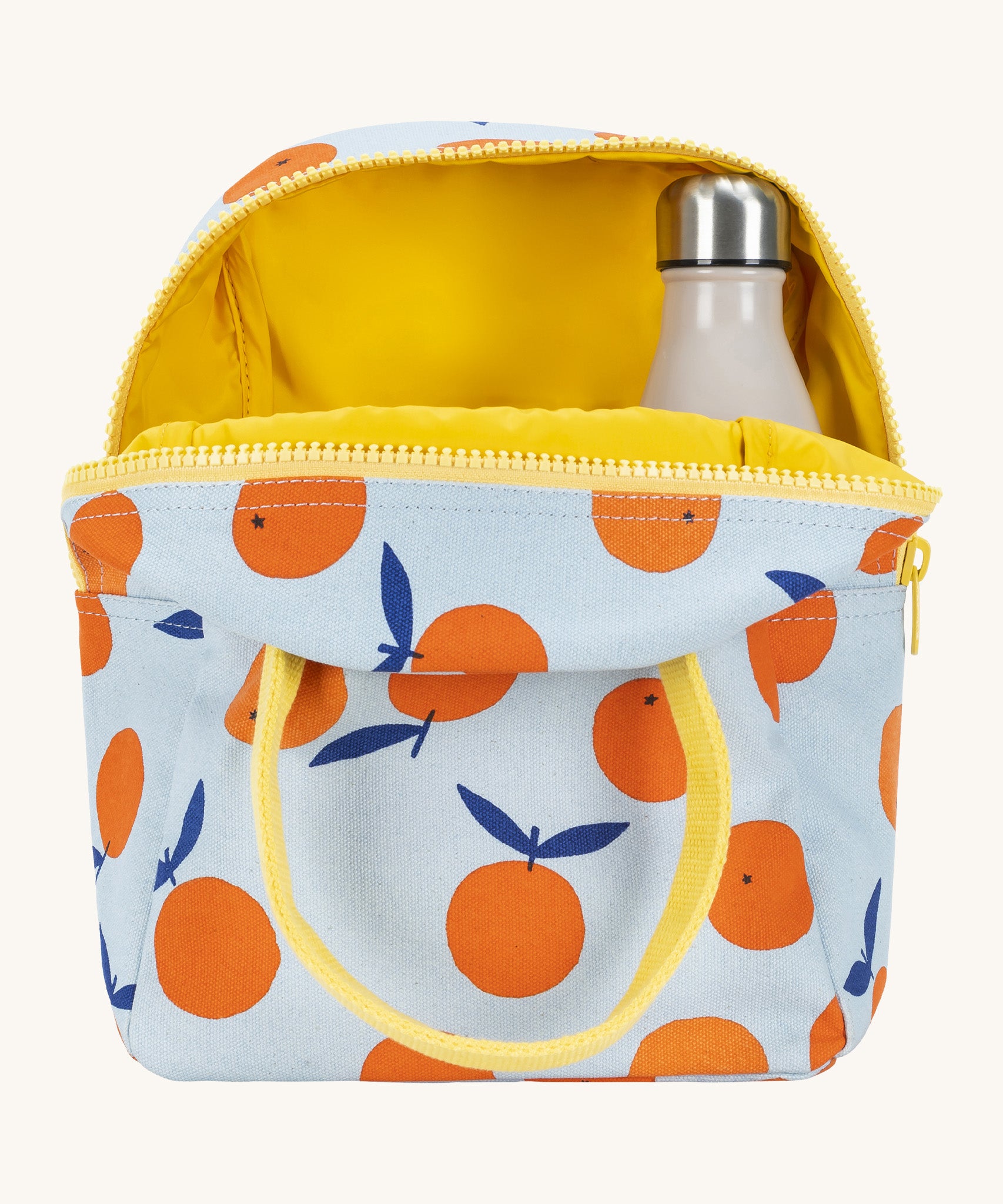 Fluf zip orange lunch bag in a light blue colour showing the yellow inner lining holding a bottle.