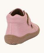 The back of a Froddo barefoot Autumn children's shoe in pink available at Babipur showing the padded ankle and the dark brown grippy sole detail
