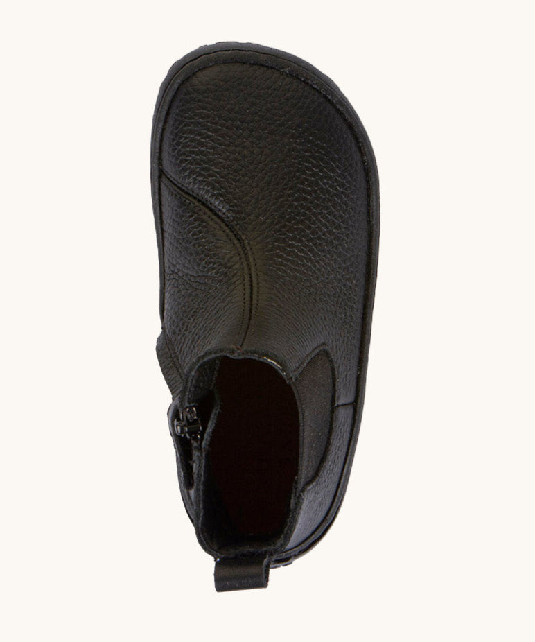 A top down image of the Froddo barefoot kids leather school chelsea boots available at Babipur showing the pull tab and insole detail