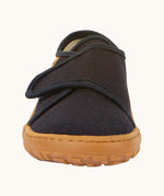 The front of the Froddo barefoot kids slipper in dark blue available at Babipur. showing the velcro strap and grippy sole detail