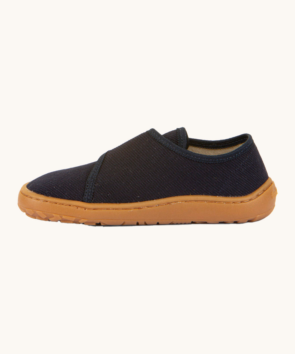 A side image of the Froddo barefoot kids slipper in dark blue available at Babipur showing the velcro fastener detail