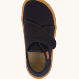 A top down image of the Froddo barefoot kids slipper in dark blue available at Babipur. showing the velcro strap and insole detail