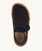 A top down image of the Froddo barefoot kids slipper in dark blue available at Babipur. showing the velcro strap and insole detail