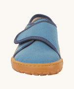 The front of the Froddo barefoot kids slipper in denim blue available at Babipur. showing the velcro strap and grippy sole detail