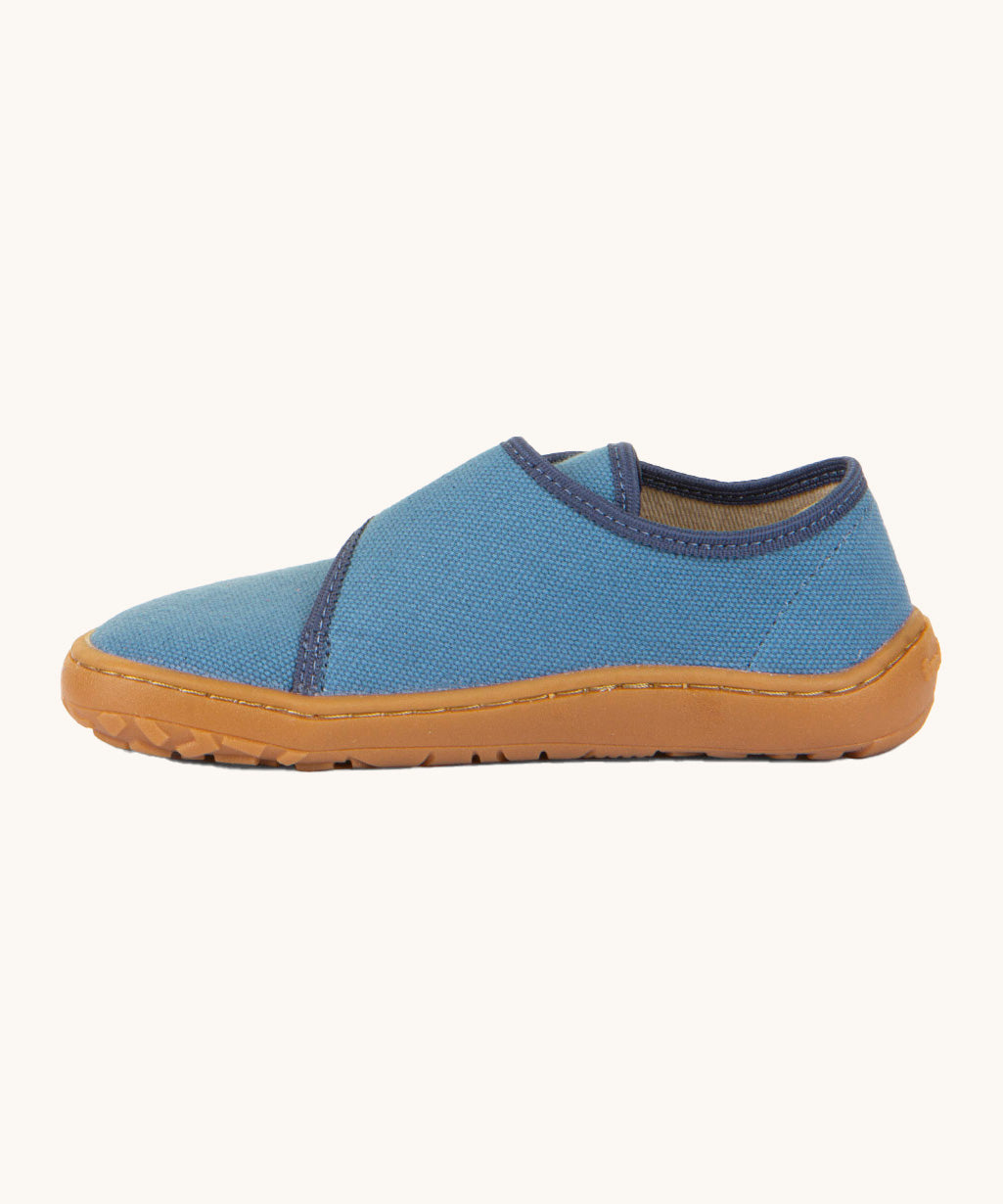 A side image of the Froddo barefoot kids slipper in denim blue available at Babipur showing the stitching detail on the grippy sole