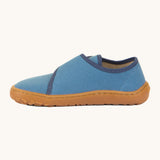 A side image of the Froddo barefoot kids slipper in denim blue available at Babipur showing the stitching detail on the grippy sole