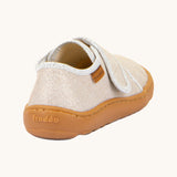 The back of the Froddo barefoot kids slipper in gold shine available at Babipur showing the branding detail on the sole