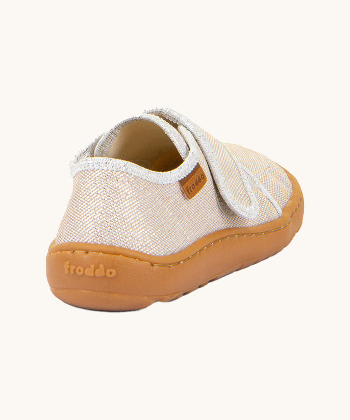 The back of the Froddo barefoot kids slipper in gold shine available at Babipur showing the branding detail on the sole