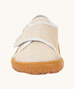 The front of the Froddo barefoot kids slipper in gold shine available at Babipur. showing the velcro strap and grippy sole detail