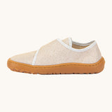 A side image of the Froddo barefoot kids slipper in gold shine available at Babipur showing the velcro fastener detail