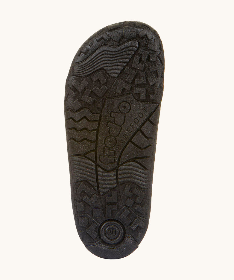 A close up of the black rubber sole detail on the Froddo barefoot leather school boots available at Babipur.