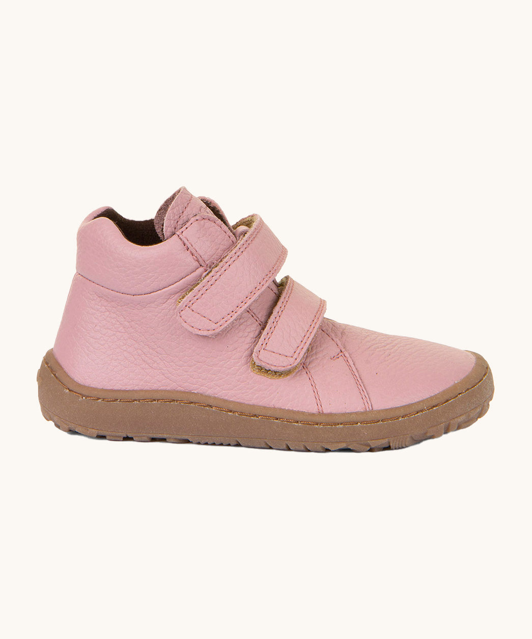 A side image of a Froddo barefoot Autumn children's shoe in pink available at Babipur. Features a brown grippy sole and 2 velcro fasteners.