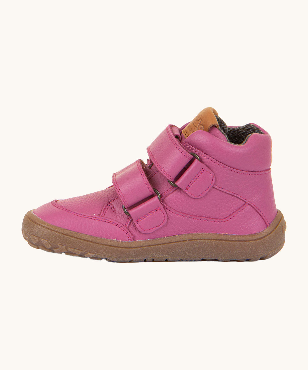 A side image of a Froddo barefoot Autumn children's shoe in fuchsia pink available at Babipur showing the 2 velcro fastener for a secure fit, padded ankle and the dark brown grippy sole