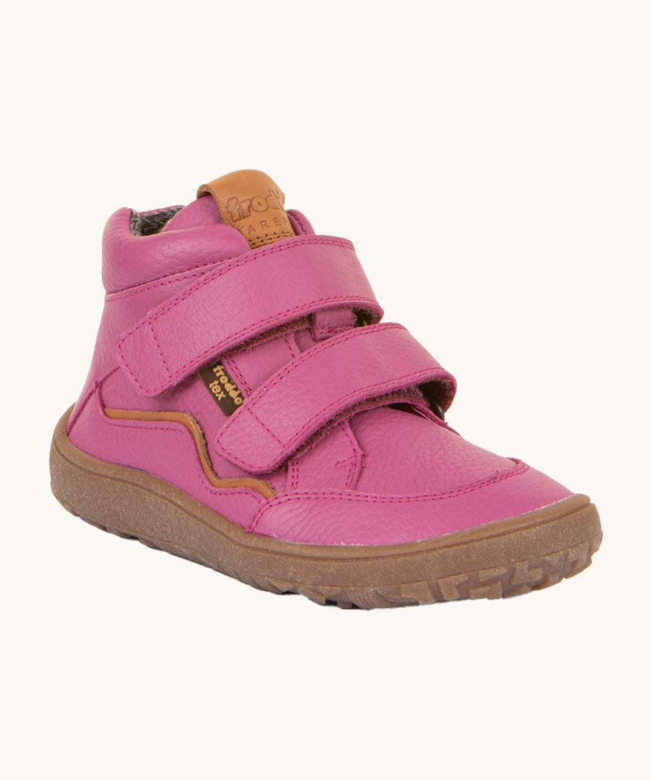 Froddo barefoot Autumn children's shoe in fuschia pink available at Babipur. A natural leather shoe with a 2 velcro fastener for a secure fit, padded ankle and a dark brown grippy sole