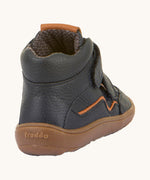 The back of a Froddo barefoot Autumn children's shoe in navy available at Babipur showing the padded ankle and the dark brown grippy sole detail