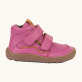 A side image of a Froddo barefoot Autumn children's shoe in fuchsia pink available at Babipur showing the 2 velcro fastener padded ankle support and the dark brown grippy sole detail