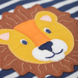 A close up of the lion's head applique on the Frugi discovery applique top in stripe/Lion available at Babipur
