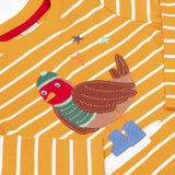 A close up of the robin applique on the Frugi discovery applique top in stripe/polar bear available at Babipur. Robin is wearing a greeb winter hat, top and blue boots.