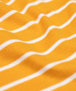 A close up of the orange and white stripe detail on the Frugi discovery applique top in stripe/polar bear available at Babipur.