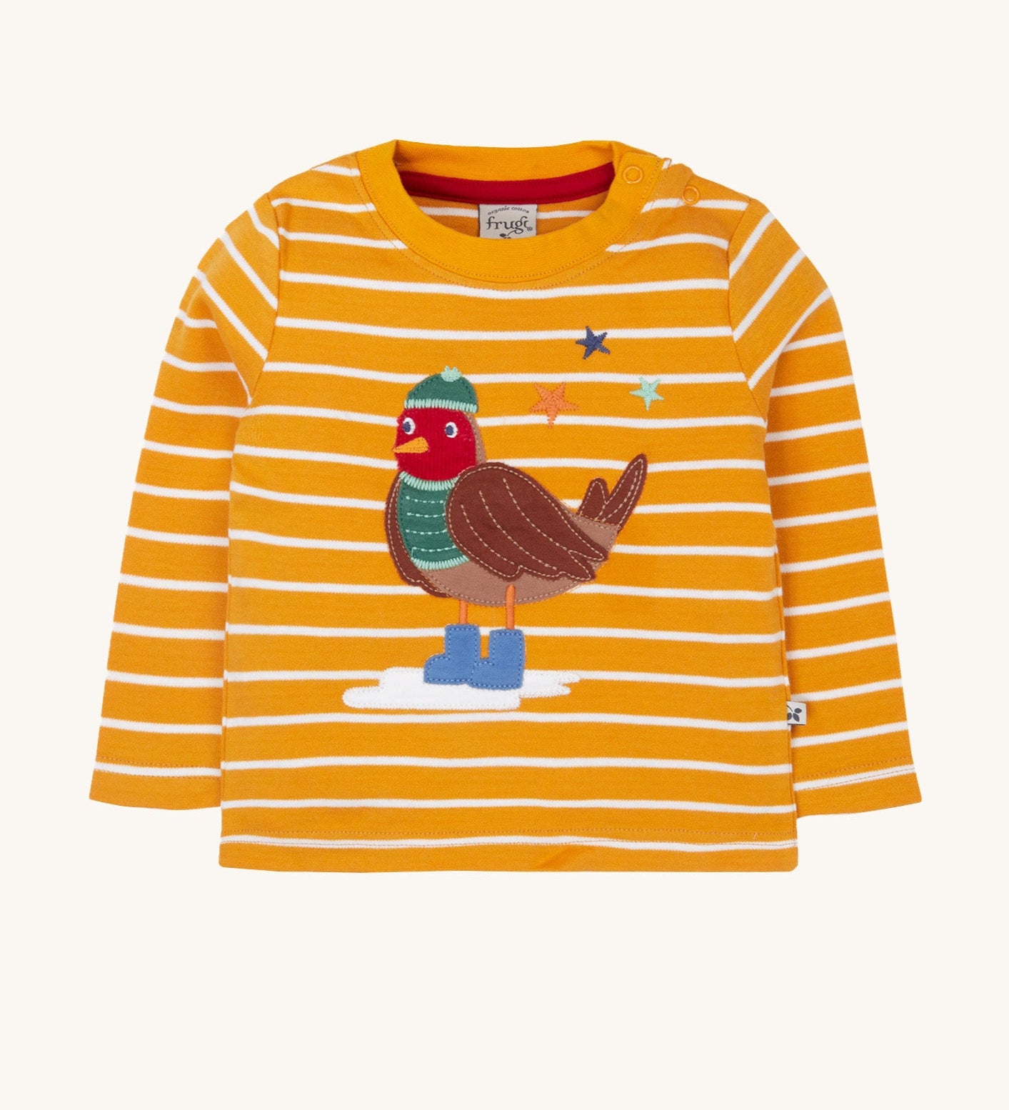 Frugi discovery applique top in gold breton/robin available at Babipur. A orange and white striped GOTS organic top with long sleeves and a cute robin applique on the front. Features popper fasteners on the shoulder.