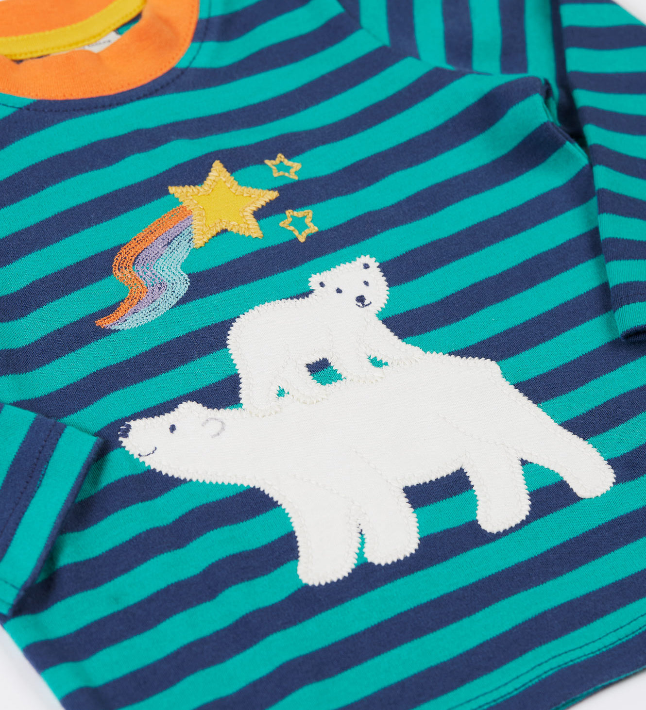 A close up of the polar bear applique on the Frugi discovery applique top in stripe/polar bear available at Babipur.