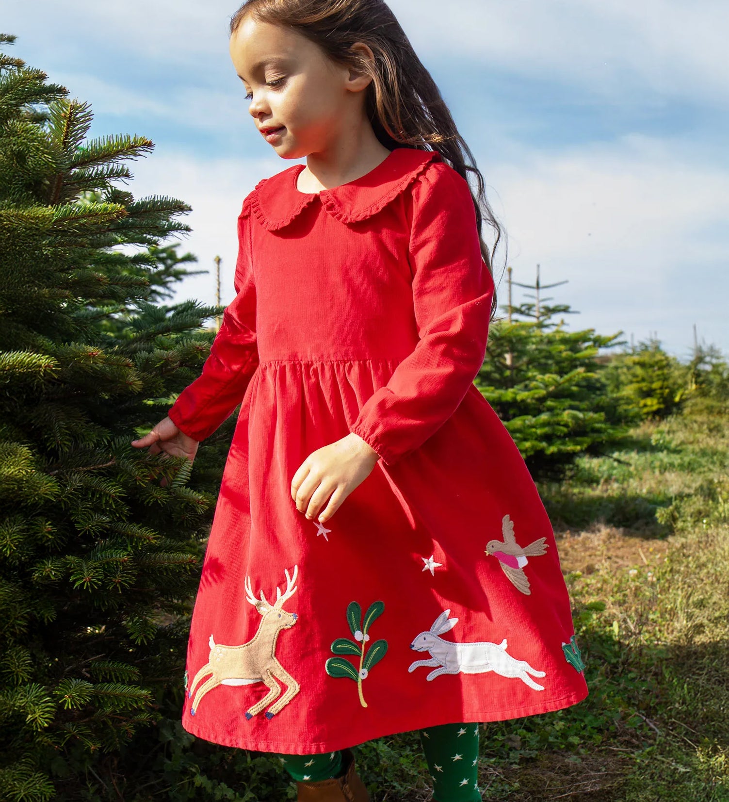 Child wearing Frugi Peony Corduroy Dress Red Robin - a Christmas party dress made from GOTS organic cotton - available at Babipur.