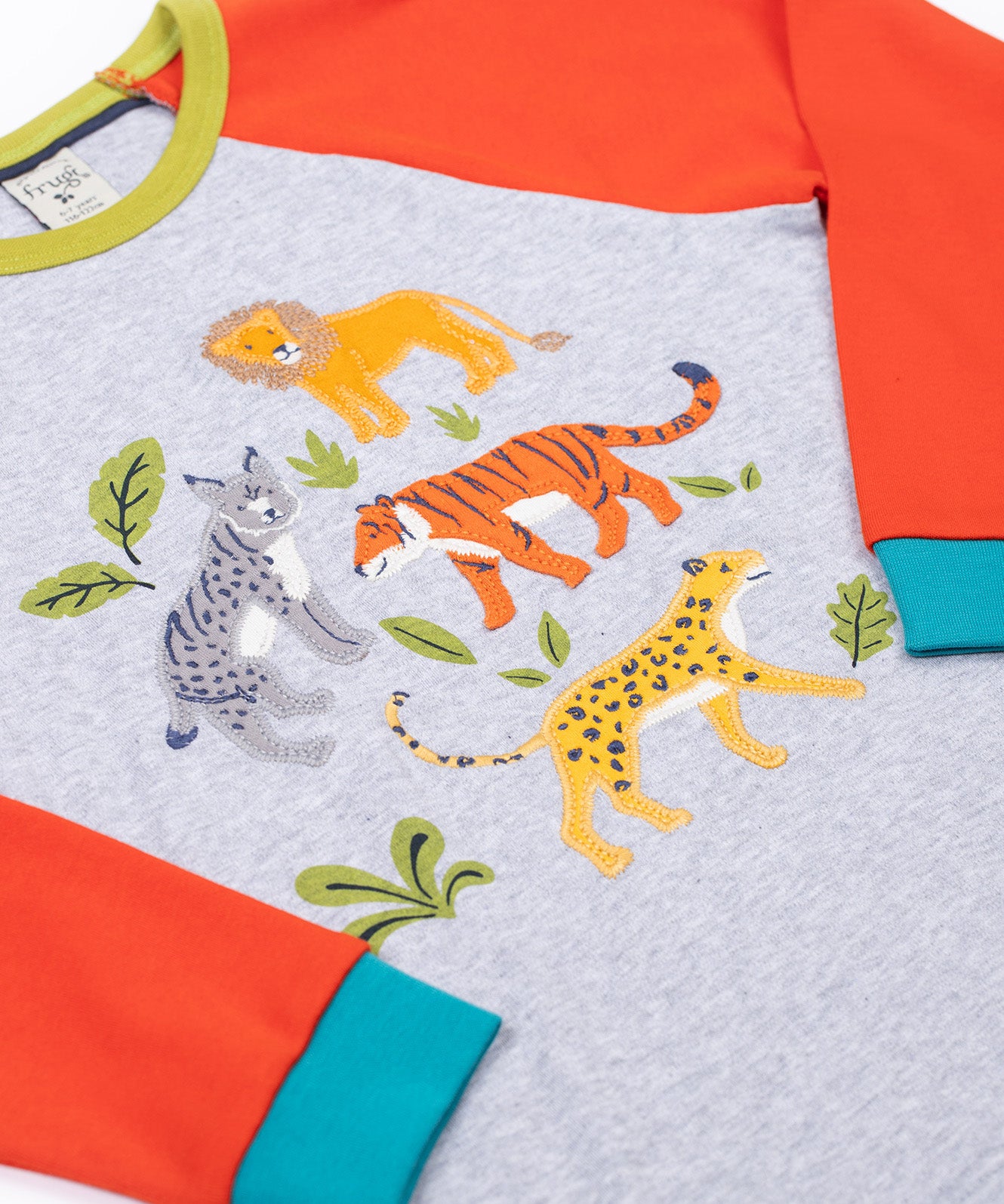 A close p of the big cats appliques on the front of the Frugi Jake Grey Big Cats Circular Organic Cotton Long Sleeved Kids' Top. The top has four big cat and leafy themed appliques on the front. This top is a part of a wide range of organic cotton clothing for children available here at Babipur.