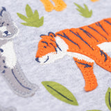 A close up of the orange tiger applique on the front of the Frugi Jake Grey Big Cats Circular Organic Cotton Long Sleeved Kids' Top. The top has four big cat and leafy themed appliques on the front. This top is a part of a wide range of organic cotton clothing for children available here at Babipur.