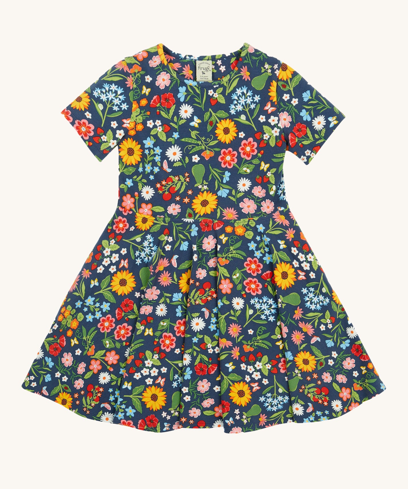Frugi navy skater dress potager garden design on a cream background.