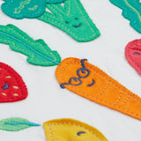 Frugi white short sleeve top, blue and red sleeves veg patch print detail