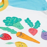 Frugi white short sleeve top, blue and red sleeves veg patch print detail