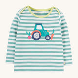Frugi striped long sleeve top tractor design on a cream background.