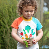 Frugi white short sleeve top, blue and red sleeves veg patch design
