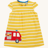 Frugi yellow striped dress fire engine design on a cream background.