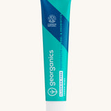 Georganics fluoride free toothpaste with pre and prebiotcs in fresh mint flavour available at Babipur. Toothpaste comes in a turquoise tube with a white lid and branding.