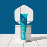 Georganics fluoride free toothpaste with pre and prebiotcs in fresh mint flavour available at Babipur with a retro white and blue background