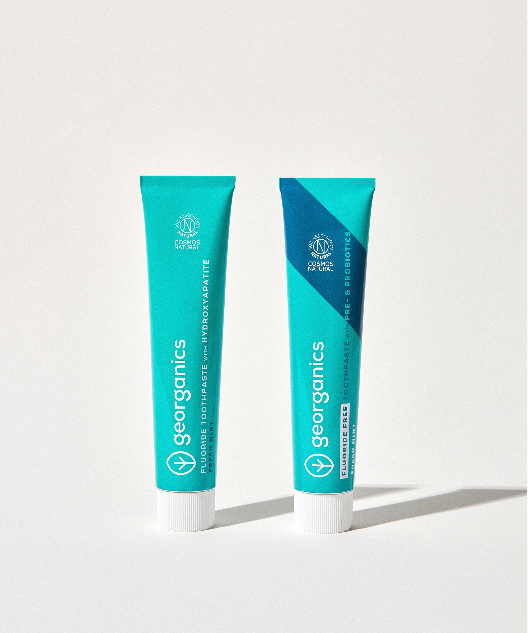 Georganics fluoride + fluoride free toothpaste with pre and prebiotcs in fresh mint flavour available at Babipur. Toothpaste comes in a turquoise tube with a white lid and branding.